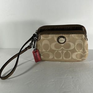 Coach wallet wristlet. Gold and tan color. Leather strap.
